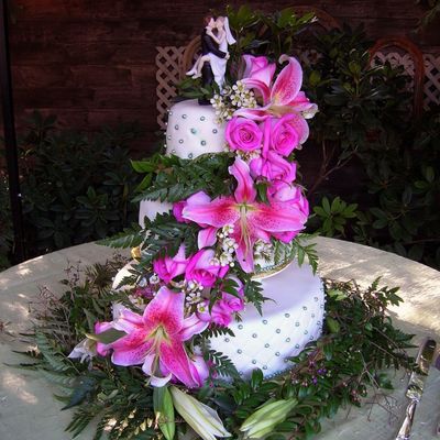 Three Tier Wedding Cake With Live Flowers. Three Tier Wedding Cake With Live Flowers.