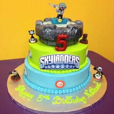 Skylander Cake With A Chocolate Bottom Tier White Middle And Rct Top Covered In Fondant Characters Were Purchased And The Logo Was Done O Skylander Cake With A Chocolate Bottom Tier White Middle And Rct Top Covered In Fondant Characters Were Purchased And The Logo Was Done O