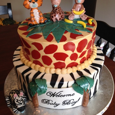 Jungle Themed Baby Shower Vanilla Top Tier With Chocolatechocolate Hazelnut Bottom Tier Covered In Buttercream Gumpaste Animals And Acc Jungle Themed Baby Shower Vanilla Top Tier With Chocolatechocolate Hazelnut Bottom Tier Covered In Buttercream Gumpaste Animals And Acc