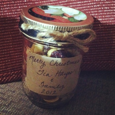 Holiday Gifted Trail Mix In A Jar Handcrafted With Decorative Ribbon Bow And Fabric On The Lid Holiday Gifted Trail Mix In A Jar Handcrafted With Decorative Ribbon Bow And Fabric On The Lid