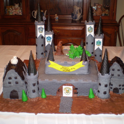 Hogwarts Cake For My Grandson Birthday Buildings Are Rice Treat Covered In Fondant Everything Was Edible Signs Were Made From Edible Ink He...