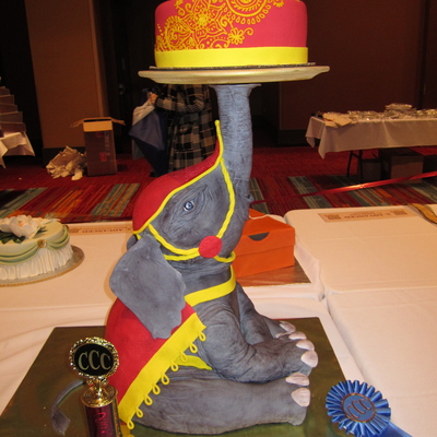 Baby Elephant Holding Tiered Cake Baby Elephant Holding Tiered Cake