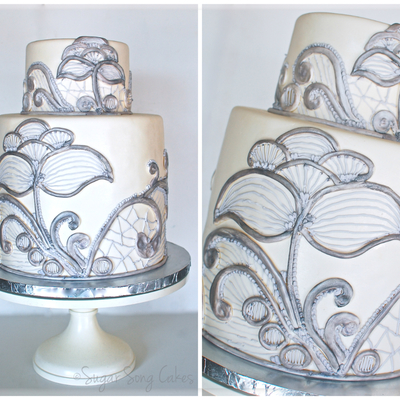 Double Barrel 10 Round With 6 Topper Fondant Covered With Hand Crafted Lace Made Of Fondant And Royal Icing That Was Painted With Silver Double Barrel 10 Round With 6 Topper Fondant Covered With Hand Crafted Lace Made Of Fondant And Royal Icing That Was Painted With Silver