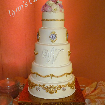 Baroque Style Brides Cake Buttercream Iced Cake With Gold Dusted Fondant Details Rhinestone Studs Rhinestone Brooches And Rhinestone Mon