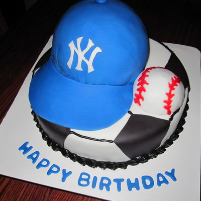 Cake For A Soccer Player Who Loes The Yankees Bottom Is A 10 Round Covered In Buttercream With Black Fondant Accents Hat Is A 6 Round Cake For A Soccer Player Who Loes The Yankees Bottom Is A 10 Round Covered In Buttercream With Black Fondant Accents Hat Is A 6 Round