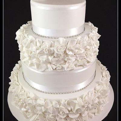 A Four Tier Wedding Cake With Ruffle Flowers Inside There Was Dark Chocolate Mud Cake With Dark Chocolate Ganache The Two Decorated Tier A Four Tier Wedding Cake With Ruffle Flowers Inside There Was Dark Chocolate Mud Cake With Dark Chocolate Ganache The Two Decorated Tier
