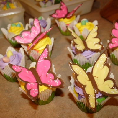 Easter Spring Time Butterfly Cupcakes The Cupcakes Were Tinted To Have Bright Colours Purplepink Yellowpink Greenpurple And Froste