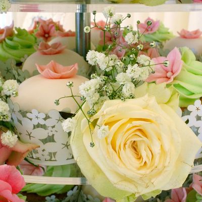 Close Up Of A Seven Tier Cupcake Tower Filled With Vanilla Cupcakes And Decorated With Fresh Flowers See More At Httpthesugarmiceblogb