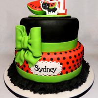Watermelon Birthday Cake This cake was so much fun. The mom sent me pictures of her little girl's birthday out fit and I got to design a cake to match. All...