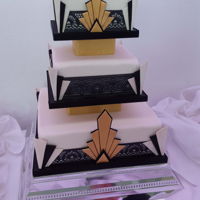 Art Deco Wedding Cake Everything (except the polystyrene separators) is edible. Pastillage corners and decoration, black cake lace, white fondant. Vanilla...