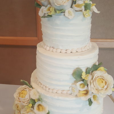 Ivory Wedding Cake With Yellow Accents And Ribbon Textured Buttercream Ivory Wedding Cake With Yellow Accents And Ribbon Textured Buttercream