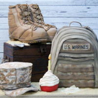United States Marine Corps Birthday Cake Carved boots, rucksack, footlocker and hat cakes. Cupcake is rice crispie treat and dog tags are modeling paste. Cake served approximately...