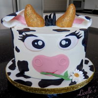 Cute Cow Cake Cute Cow Marble cake in buttercream with fondant decorations. The horns are rice bubble treats covered in fondant and painted gold.