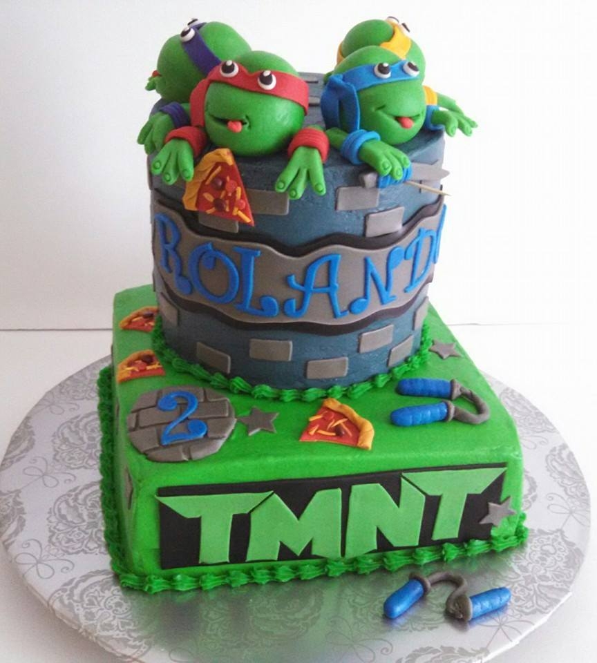 Another Ninja Turtle Cake , With Pizza Slices And Weapons Buttercream Cake With Fondant