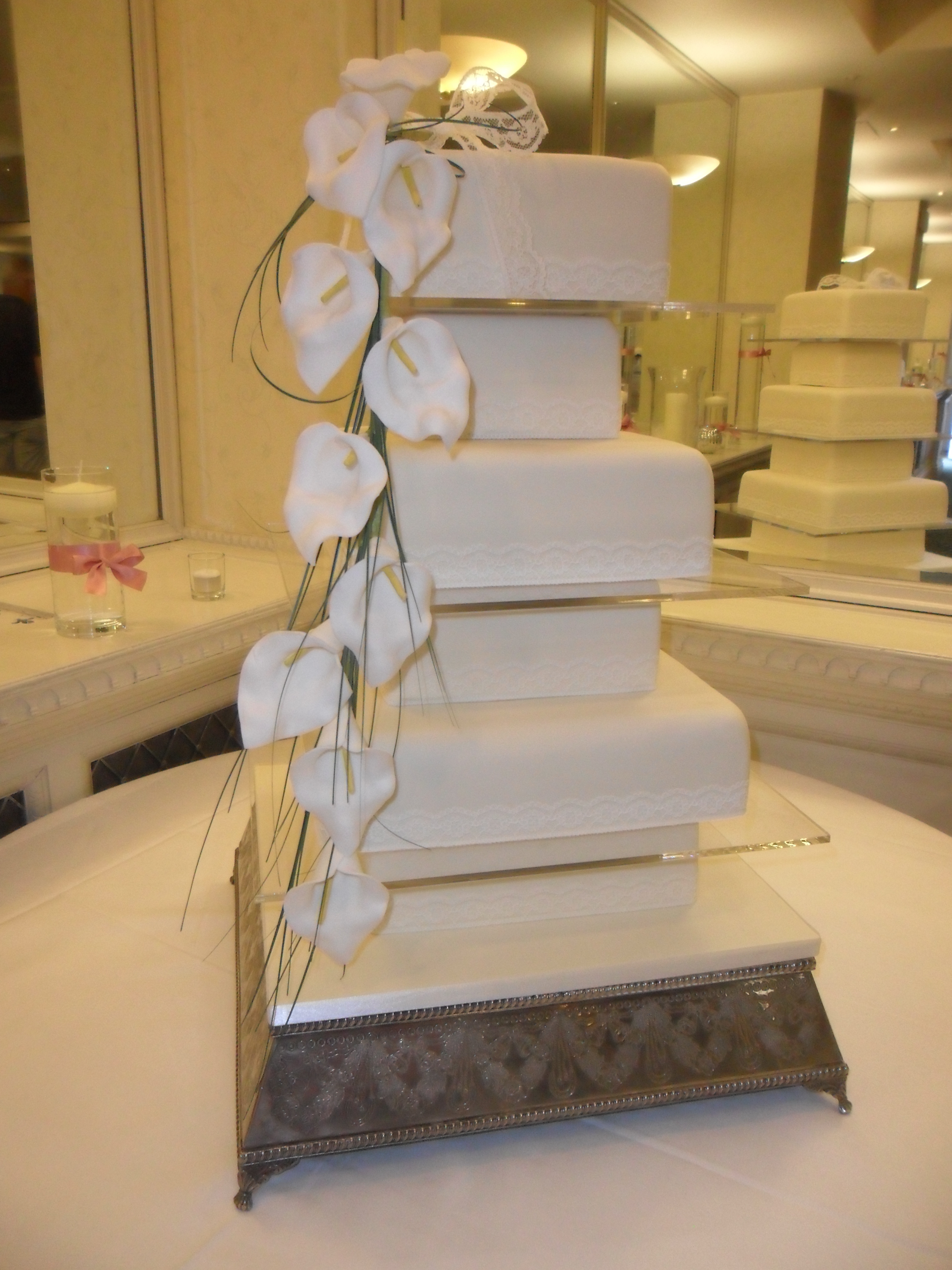 6 Tier Ivory Wedding Cake With Orchid Spray