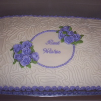 Best Wishes sheet cake covered in butter cream with butter cream roses