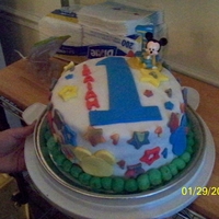 Mickey Mouse 1St Birthday Cake I made this for a baby boy's 1st birthday. Yellow cake with strawberry filling and fondant.