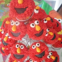 Elmo Cupcakes For my oldest son's fifth birthday. Buttercream "fur," fondant eyes, noses and mouth.