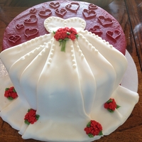 Kelley's Bridal Shower WASC cake with lemon filling. Red buttercream with white fondant dress and red fondant flowers.