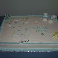 163.jpg Half sheet... half chocolate,half white cake mix with almond-buttercream icing. MMF onesie and booties.