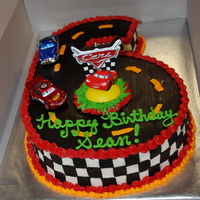 Cars Cake Chocolate cream cake covered with buttercream and fondant accents.