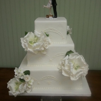 Sugar Peonies, Roses, And Pulled Flowers Fondant cake decorated with sugar peonies, roses, and pulled flowers. Design piped in buttercream and inspired by brides gown. Bride...