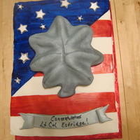 Lt Col Promotion Fondant flag painted with airbrush colors. RKT oak leaf covered in fondant. Design based on CakeLava cake.