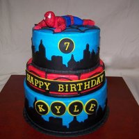 Spiderman Another Spiderman cake. Buttercream Icing with fondant accents. Spiderman made out of fondant as well. Used my cricut for the city skyline...