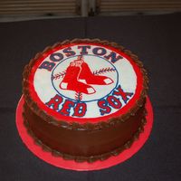 Redsox Grooms Cake Vanilla caramel cake with chocolate icing and a FBCT of the Red Sox logo.