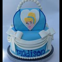 Cinderella Purse Cake MMF covered 8" with a 6" purse cake. The purse cake was inspired by Jessicakes ( instruction at jessicakesblog.blogspot.com/2012/...