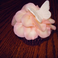Flower Cupcake Chocolate cupcake with baked coconut filling. Fondant butterfly