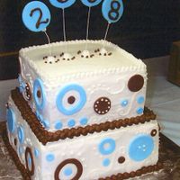 Blue Brown Modern Graduation Cake Butter cream square cakes with Fondant cut-outs and Fondant circles on florist wire inserted into the top of the cake.