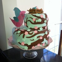 Baby Reveal - Bird I made this cake for a Baby Reveal. Yellow cake, buttercream icing and covered in fondant. The flowers are royal icing apple blossoms. The...