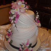 Pink/black Wedding Roses, orchids, sweet peas, filler flowers, all sugarpaste