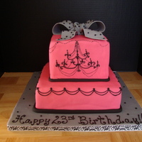 Chandelier Birthday Square cake covered in fondant with RI chandelier piped with some string work. Also, the bow is gumpaste with RI dots! Thanks for looking...