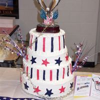 Stars And Stripes 3 tier cake, covered in buttercream with fondant stars and stripes. Thecake was auctioned off at a cake auction for the high school ($800)...