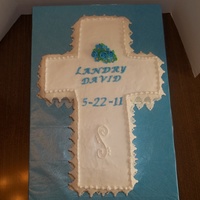 Cross butter cream with fondant lace and flowers