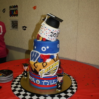 Connor's Grad Cake My first cake disaster, it tipped, it wobbled, it was almost dropped but we got it to the party. It had some cracks and decorations chipped...