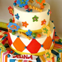 6Th Birthday Carnival Cake For my daughter's 6th birthday. It was a carnival themed party. All butterceam with fondant accents