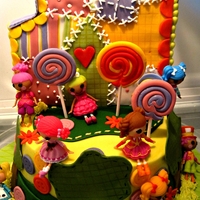 Lalaloopsy Marble cake with ganache filling iced in buttercrem. All decorations are fondant except the little people. The house is a huge sugar cookie...