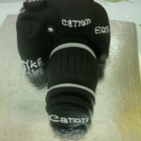 Canon Camera Cake It was fun making this camera cake. It's made of plain vanilla cake and fondant. TFL.