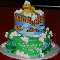 Ducky Baby Shower Cake Covered in buttercream. Bucket is made from placing cookies around the layer and covering top with piping gel . Bubbles are luster dusted...