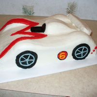 Speed Racer Mach 6 2 11x15 cakes stacked and trimmed with buttercream icing and fondant spoiler. Thanks for the ideas here on Cake Central and to my hubby for...