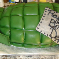 Grenade Chocolate cake w/strawberry b/c covered in fondant.Made this for my nephew's 7th military themed birthday bday. Fondant accents and...
