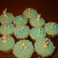 Easter Eggs And Bunnies Cupcakes Buttercream "grass" with Cadbury's Mini Eggs. Bunnies are from white chocolate modeling paste