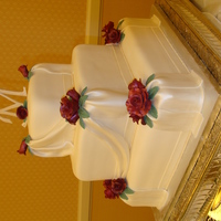 Ruby Anniversary Cake This cake was designed for an anniversary cake. The roses are gum paste with ruby luster dust. Each tier was a different flavor- decorated...