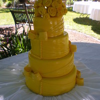 Yellow Wedding Cake 12, 10, 8, and 6 inch cakes, fondant roses. Found a picture of a cake by cakes by May and loved it do much I had to try it.