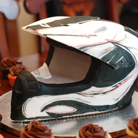 Motocross Helmet Motocross helmet made entirely out of cake. The visor is fondant that I molded to an actual helmet visor. Covered in fondant and hand...