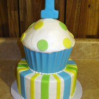 1St Birthday Cupcake Cake This is the cake I made for my cousin's first birthday. The cupcake "wrapper" is done with blue candy melts, and I used the...