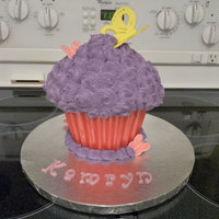 Giant Cupcake Birthday Cake Vanilla with vanilla buttercream and a candy liner. Accents are gumpaste.